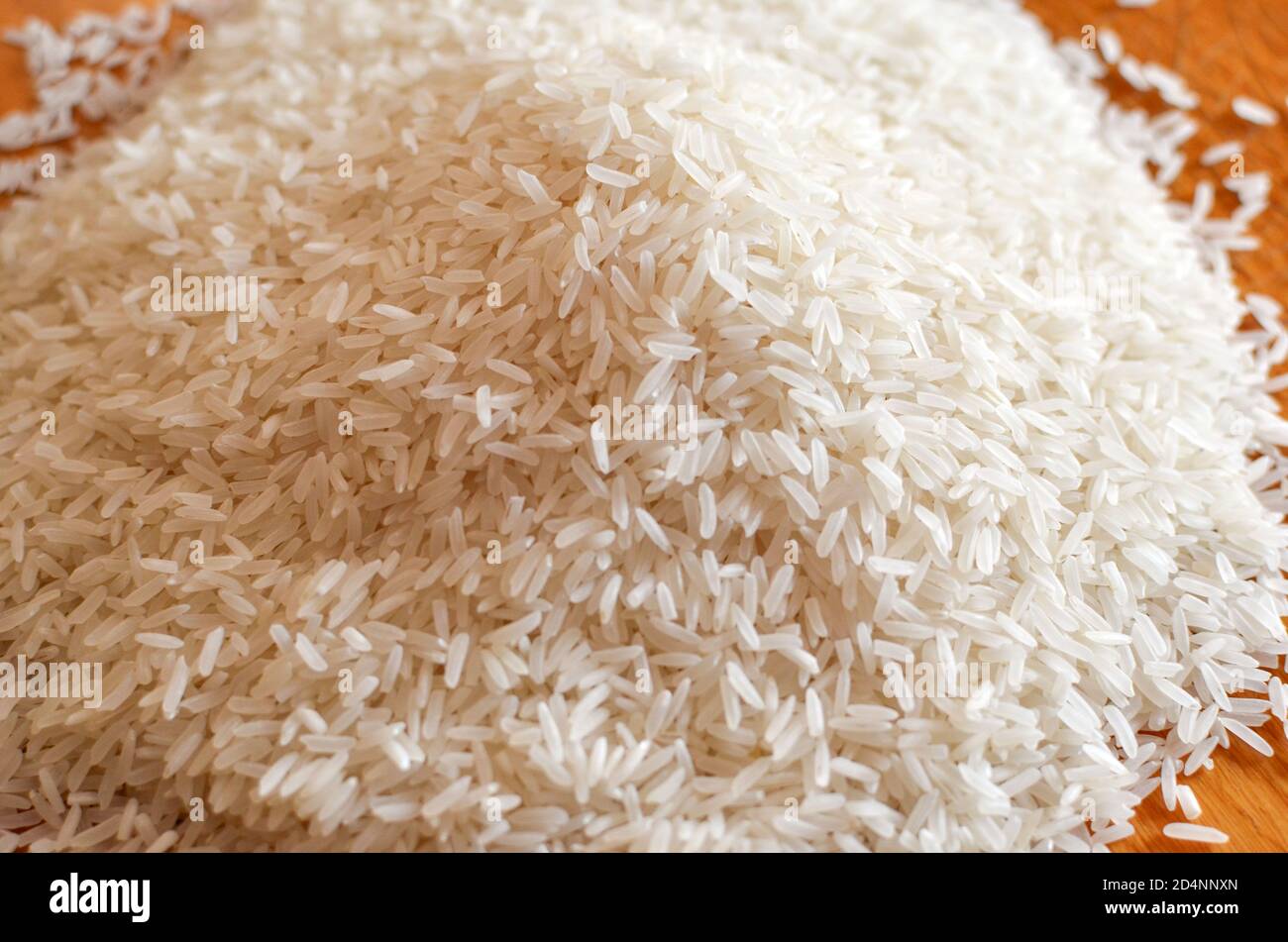 Uncooked asian white rice or Long white rice grain as background Stock