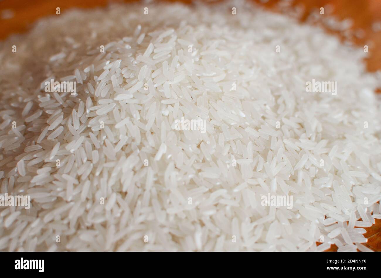 Uncooked asian white rice or Long white rice grain as background Stock ...