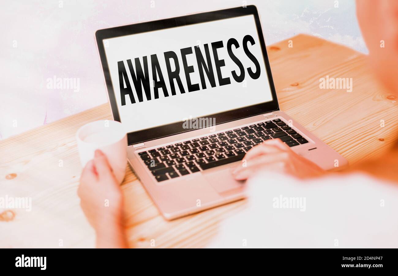 Conceptual hand writing showing Awareness. Concept meaning quality or state of being aware of knowledge and understanding Modern gadgets white screen Stock Photo
