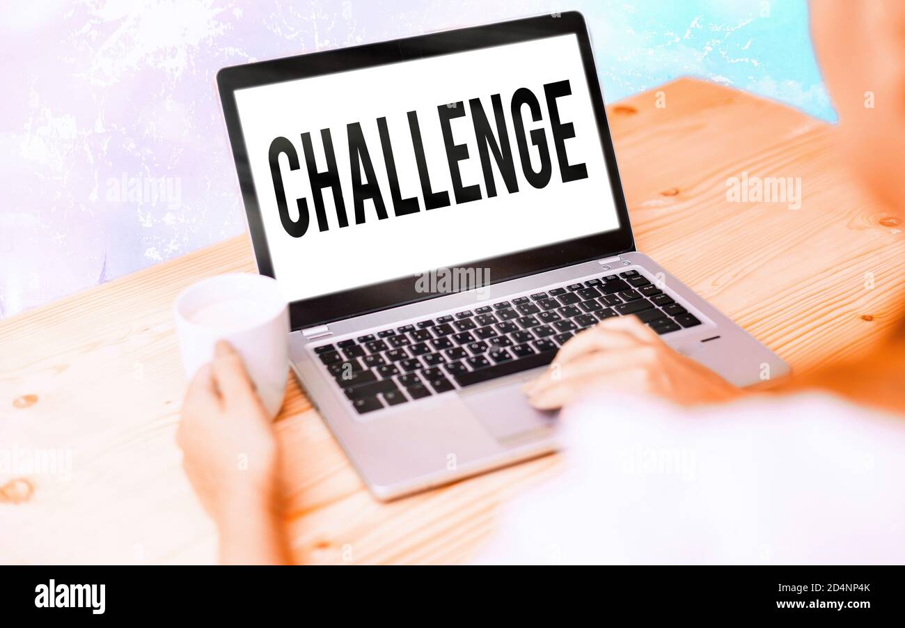 Conceptual hand writing showing Challenge. Concept meaning process of provoking or testing physiological activity by exposure Modern gadgets white scr Stock Photo