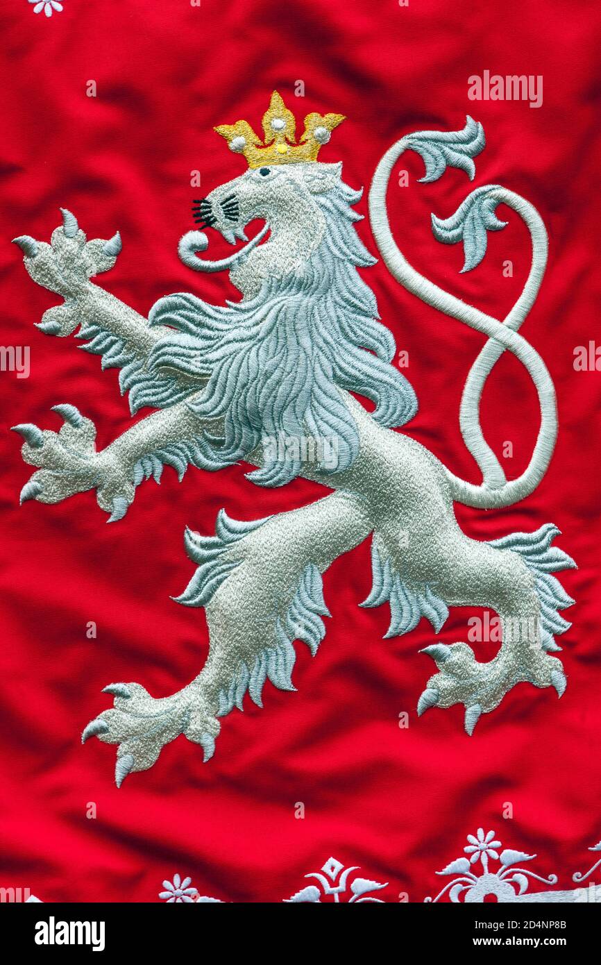 Czech lion, white two - tailed lion embroidered on red flag Stock Photo
