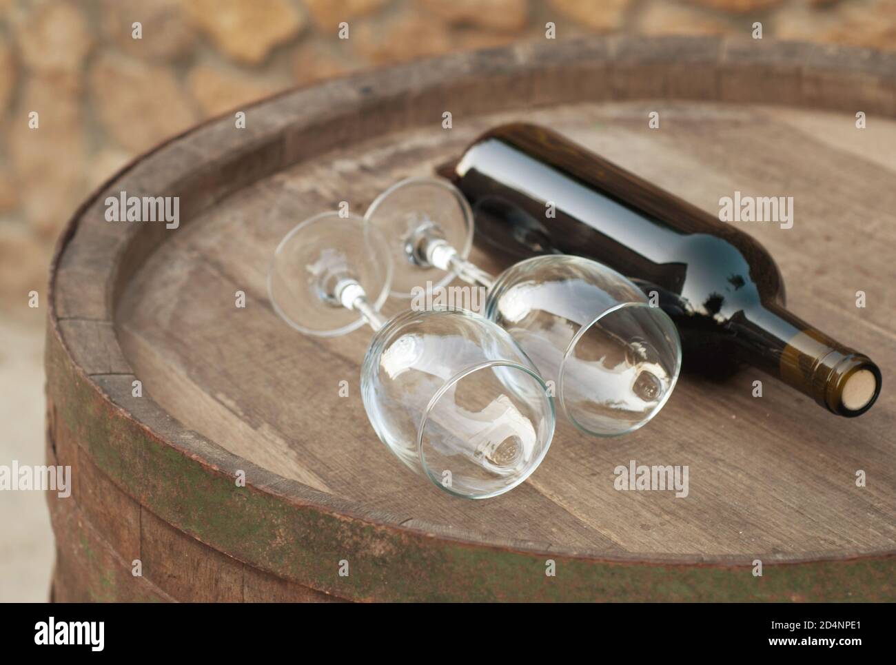 bottle over wine barrel Stock Photo