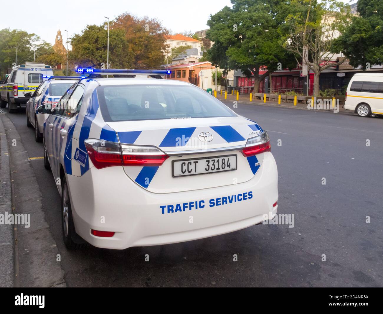 police vehicles and traffic services cars parked in a road during lockdown in Cape Town, South Africa Stock Photo