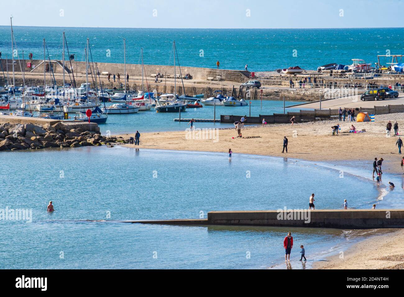 Lyme Regis, Dorset, UK. 9th Oct, 2020. UK Weather: Locals and visitors enjoy a bright and sunny start to the weekend at the seaside resort of Lyme Regis. Credit: Celia McMahon/Alamy Live News Stock Photo