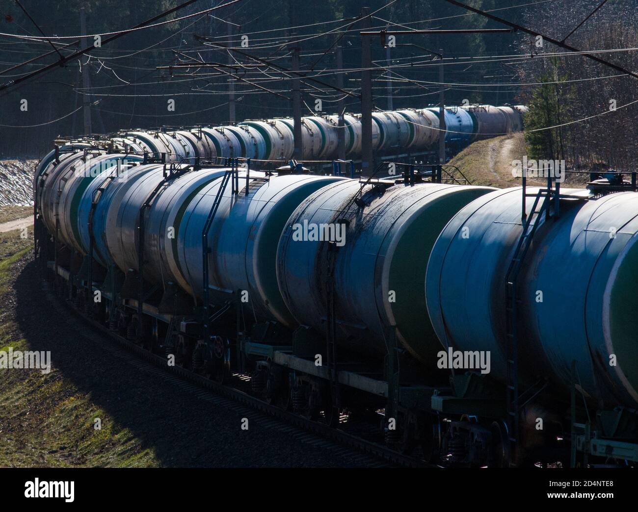 Freight train with petroleum tank cars on railroad. Rail cars carry oil