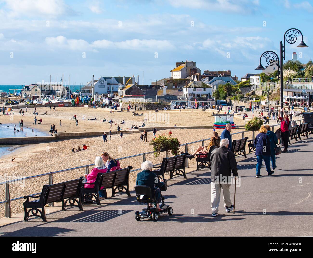 Lyme Regis, Dorset, UK. 9th Oct, 2020. UK Weather: Locals and visitors enjoy a bright and sunny start to the weekend at the seaside resort of Lyme Regis. Credit: Celia McMahon/Alamy Live News Stock Photo