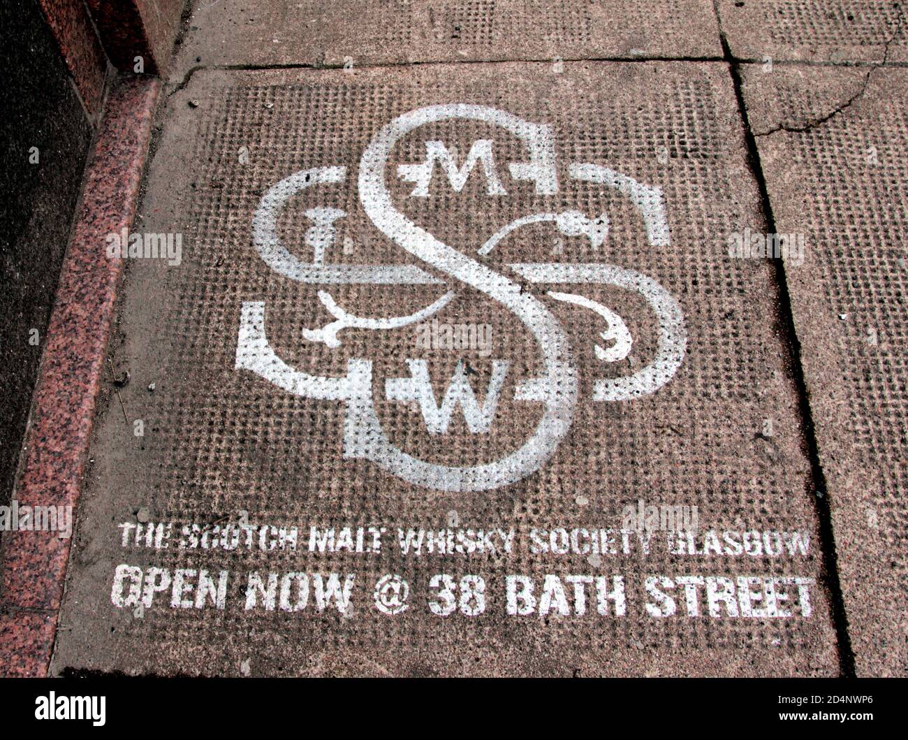 Unusually, a stencilled sign on the pavement, indicates that you have found the location of The Scottish Malt Whisky Society Glasgow. You will find this at No 36 Bate Street, Glasgow, Scotland. ALAN WYLIE/ALAMY© Stock Photo