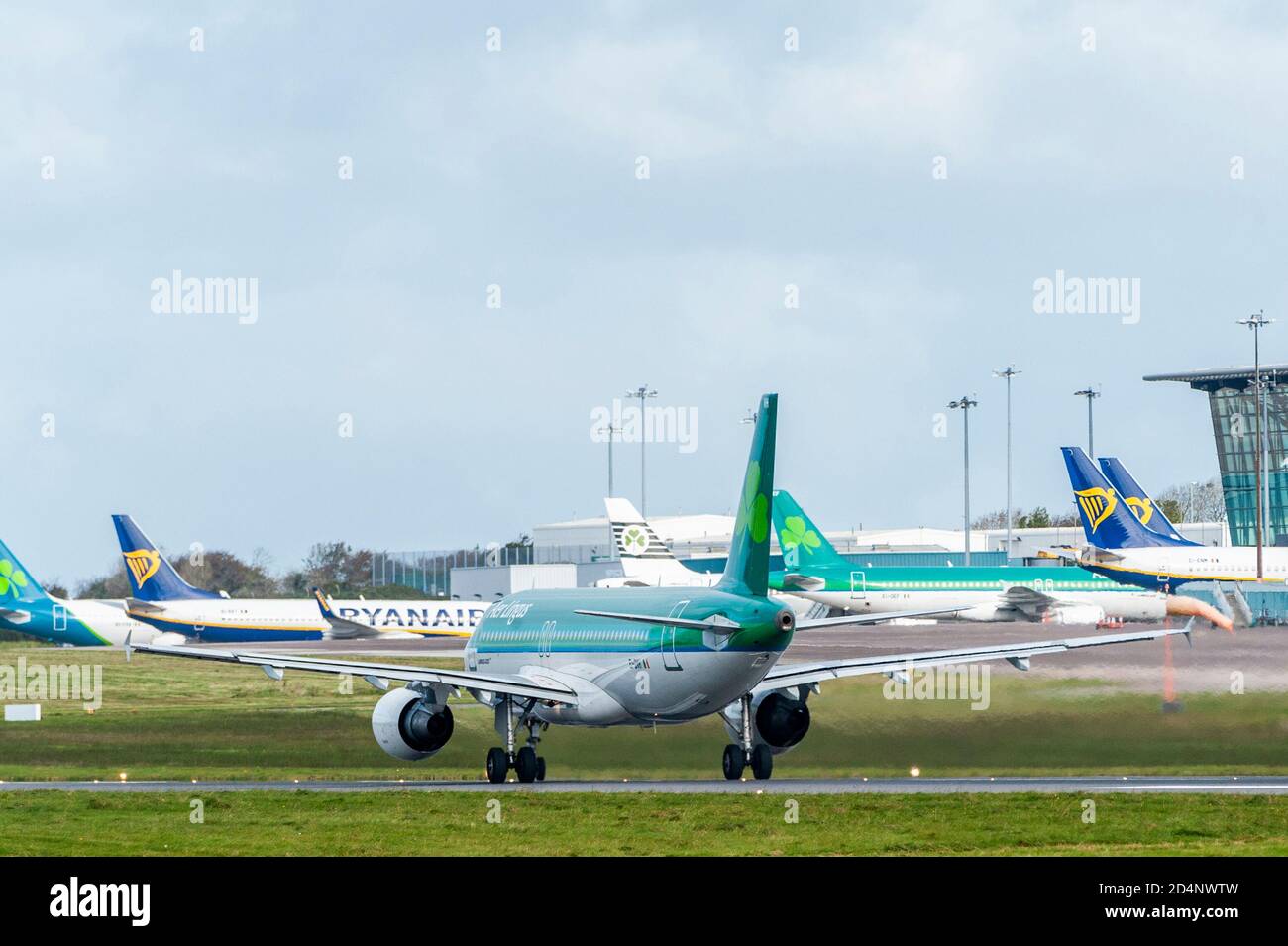 Cork, Ireland. 10th Oct, 2020. Aer Lingus and Ryanair aircraft sit redundant on the tarmac at Cork Airport as Ireland's Level 3 restrictions hit international travel hard. From Monday 12th Oct, the government has said there will be no foreign countries on the Green Travel List, meaning anyone flying into Ireland will have to self-isolate for 14 days. The next review will be on Thursday 15th October. Aer Lingus flight EI172 takes off for London Heathrow. Credit: AG News/Alamy Live News Stock Photo