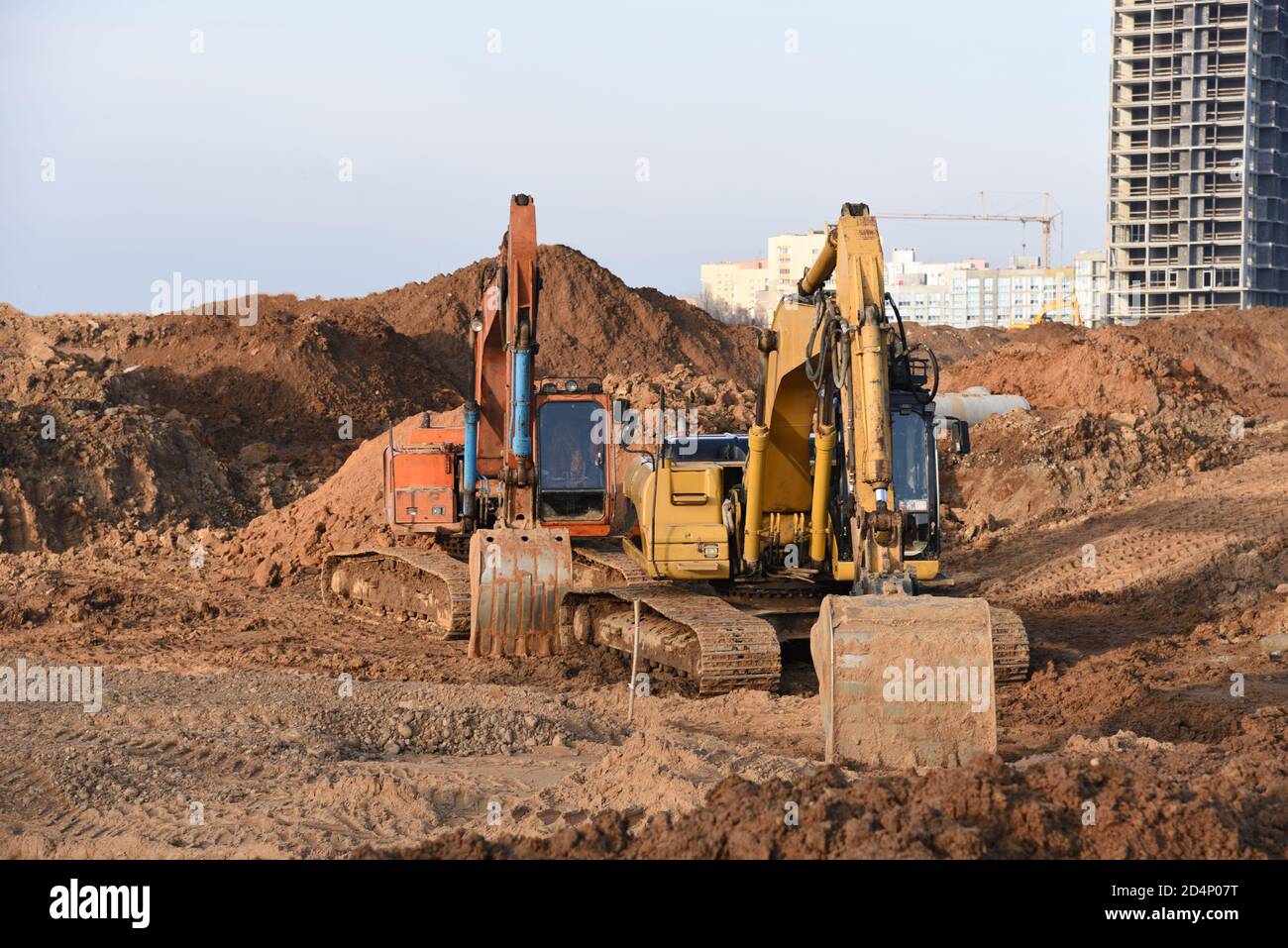 Group of the excavators for dig ground trenching at a construction site