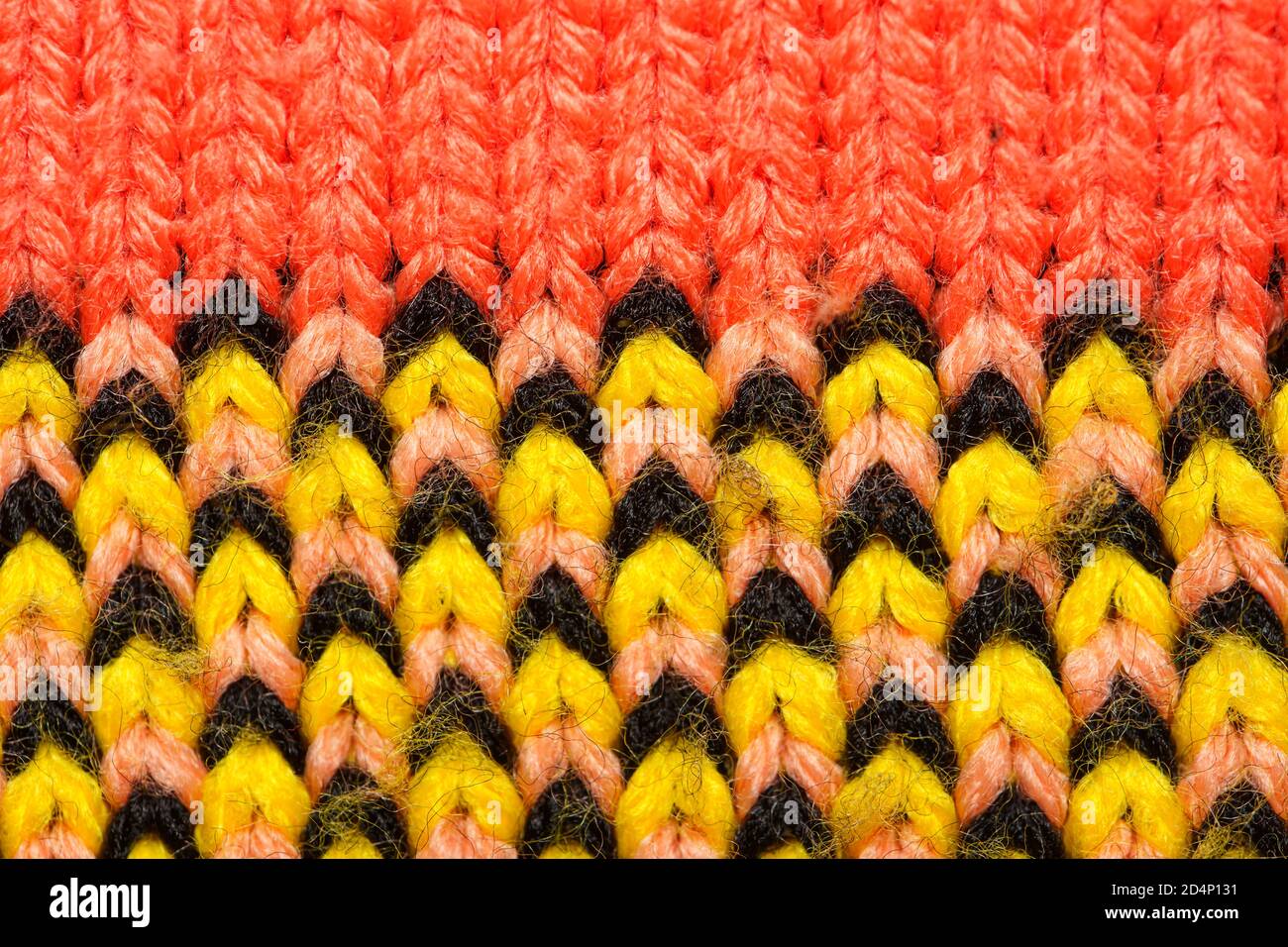 Colorful synthetic knitted fabric close up. Patterned knitted fabric texture background Stock Photo