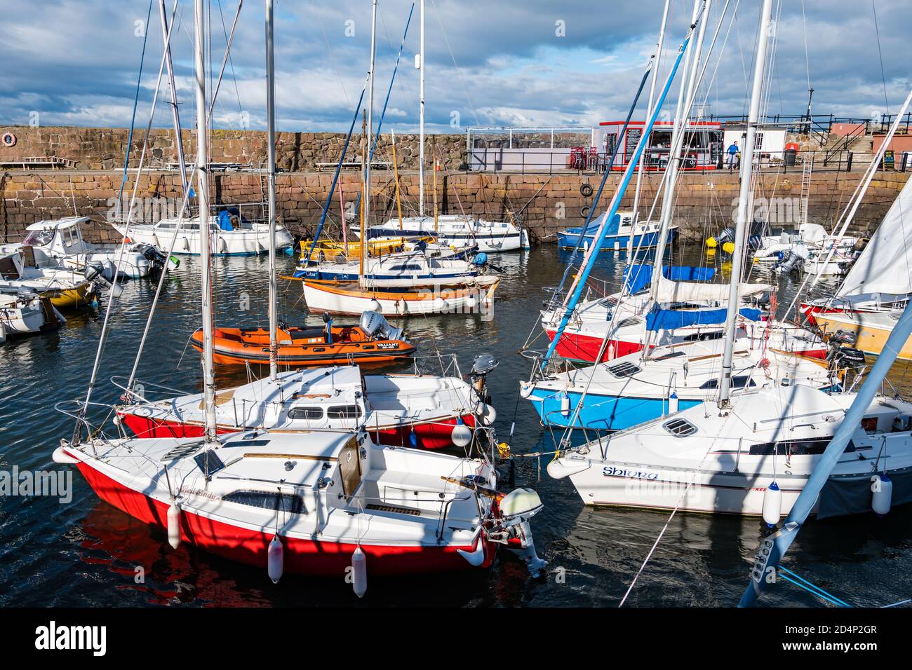 North Berwick, East Lothian, Scotland, United Kingdom, 10th October 2020. UK Weather: Colourful sailing boats and yachts in the harbour on a sunny day in the harbour Stock Photo