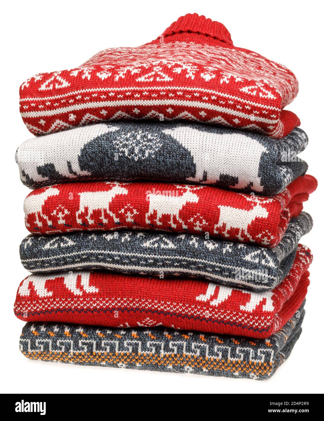 Stack of folded knitted Christmas turtleneck sweaters or pullovers with  nordic ornament isolated on white background Stock Photo - Alamy