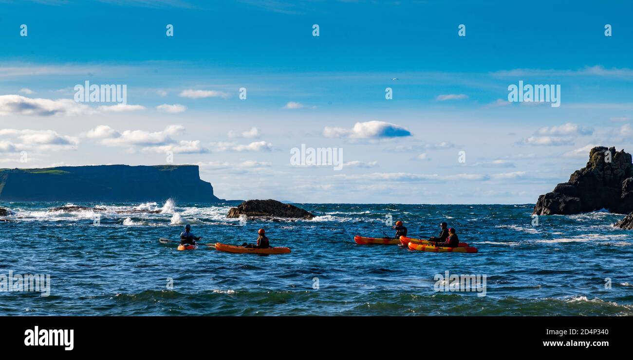 Kayaks at Ballintoy White Park Bay, North Coast, Northern Ireland Stock Photo