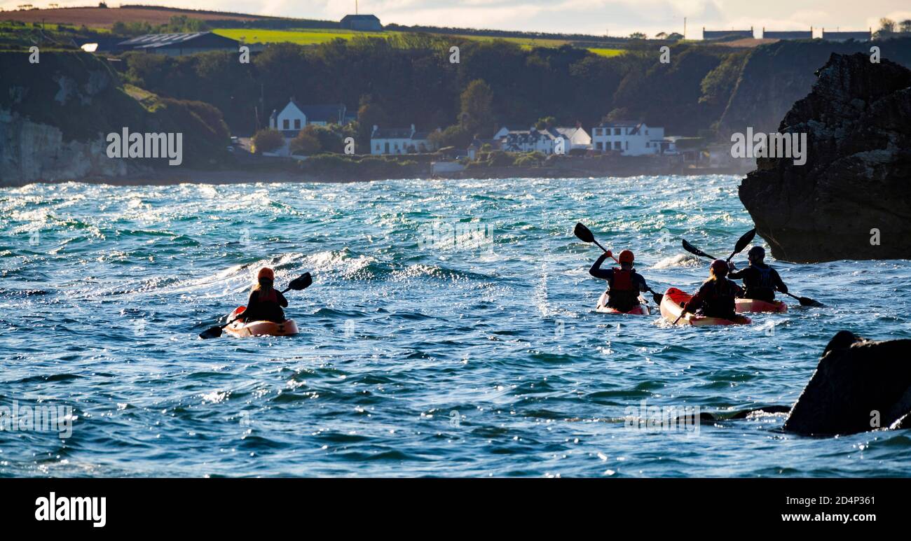 Kayaks at Ballintoy White Park Bay, North Coast, Northern Ireland Stock
