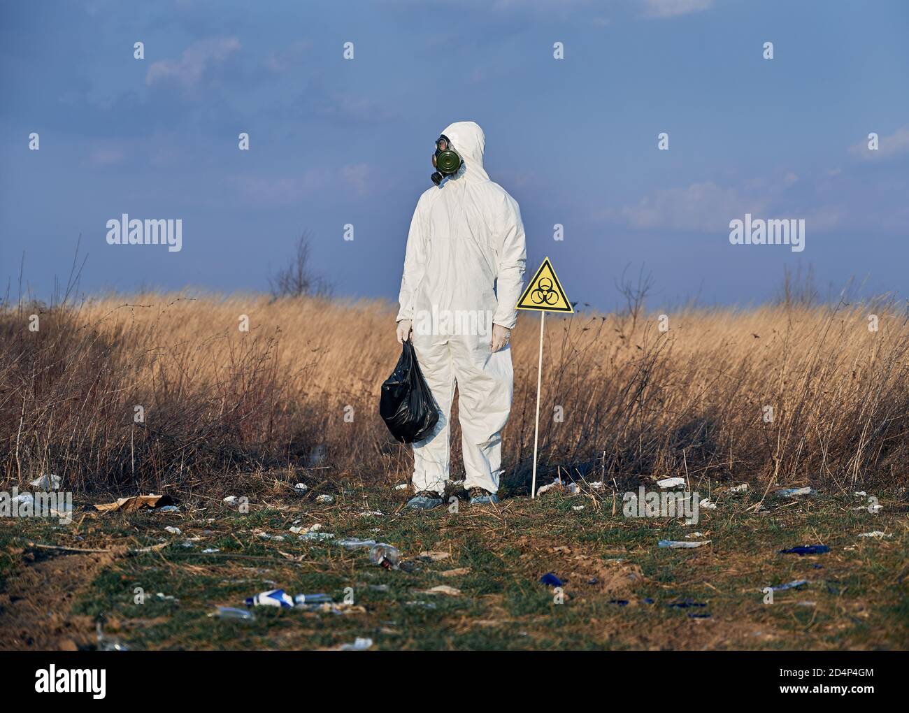 Garbege Protection Mask Researcher wearing white protective coverall, gas mask, standing in the ...