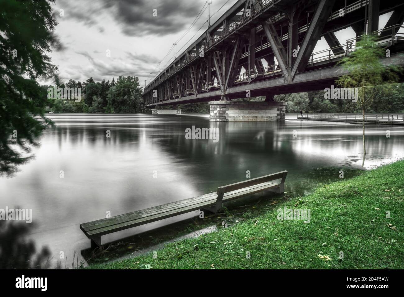 flood of the Ticino river in a cloudy day, rainy season with long time exposure Stock Photo