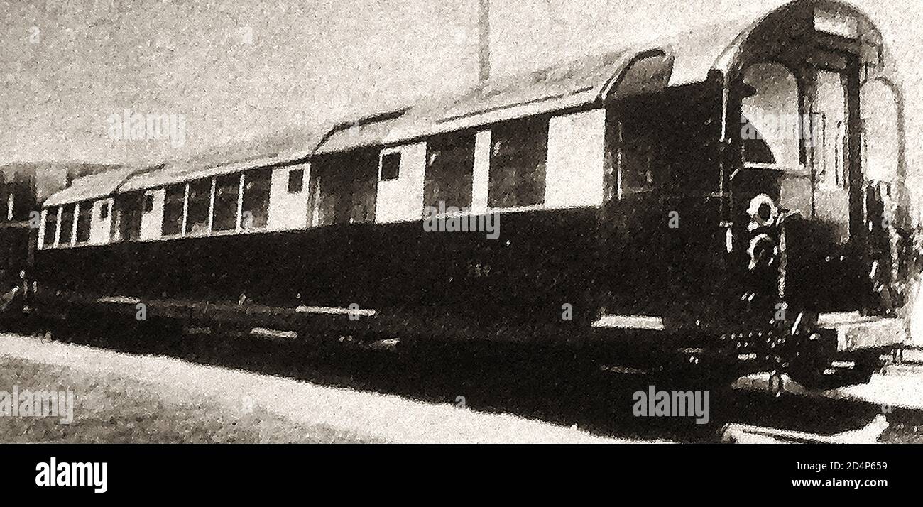 1924 brought the introduction in Britain of new electric coaches on the city and south london railway (news image). The City and South London Railway (C&SLR) was the first deep-level underground 'tube' railway in the world, and the first major railway to use electric power. Though originally intended for cable-hauled trains,  the cable contractor  went bankrupt during construction, and electric power     was used instead. When opened in 1890, the railway line operated 6 stations & ran for just over three miles. The small carriages with leather seats were nicknamed 'Padded Cells' by the public. Stock Photo