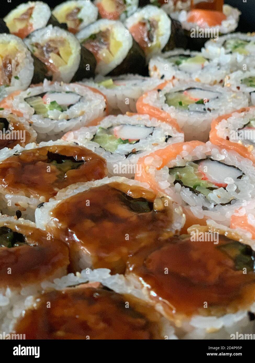 Japanese sushi food. Assorted Maki, rolls, nigiri, California maki, with tuna, salmon, shrimp