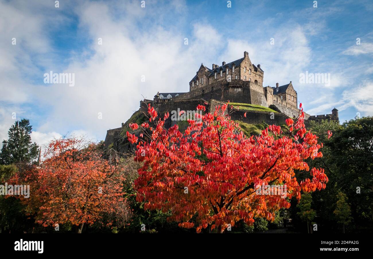 Trees in Princes Street Gardens, underneath Edinburgh Castle, display their Autumn colours Stock