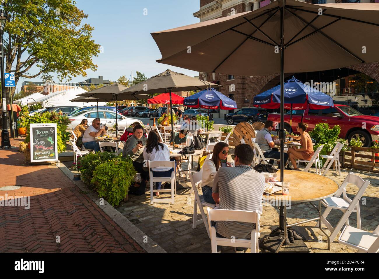 Baltimore, MD, USA -- Oct 4, 2020. Photo of people dining outdoors in the Fells Point neighborhood of Baltimore. Stock Photo