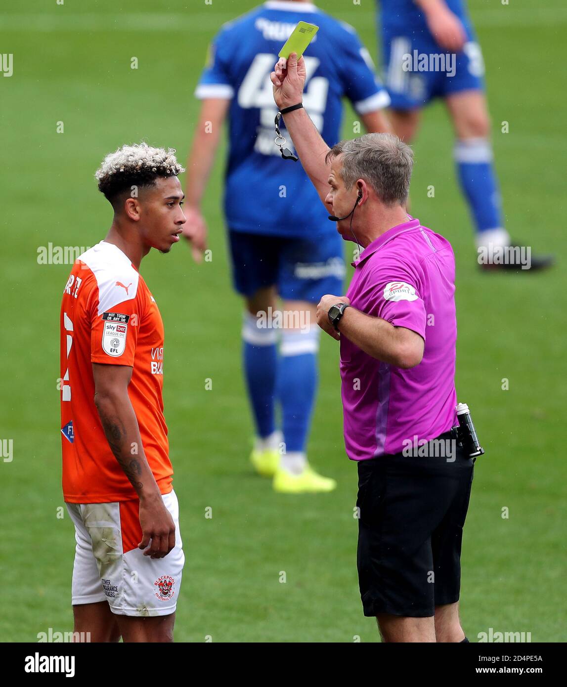 Blackpool’s Jordan Gabriel is shown a yellow card by referee Christopher Sarginson during the Sky Bet League One match at Bloomfield Road, Blackpool. Stock Photo