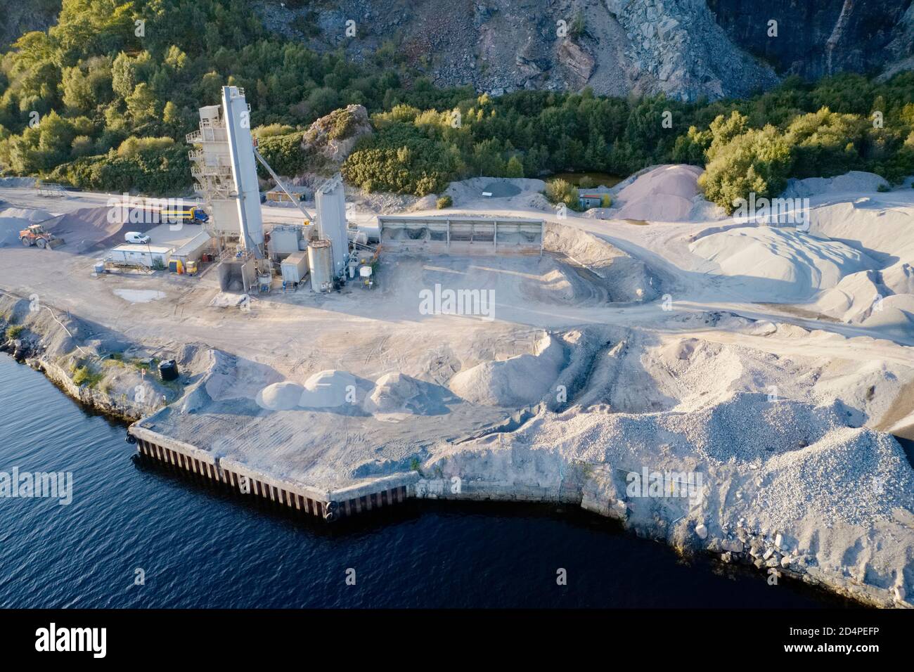 Quarry works industrial digging aerial view from above showing sand mound and hills Stock Photo