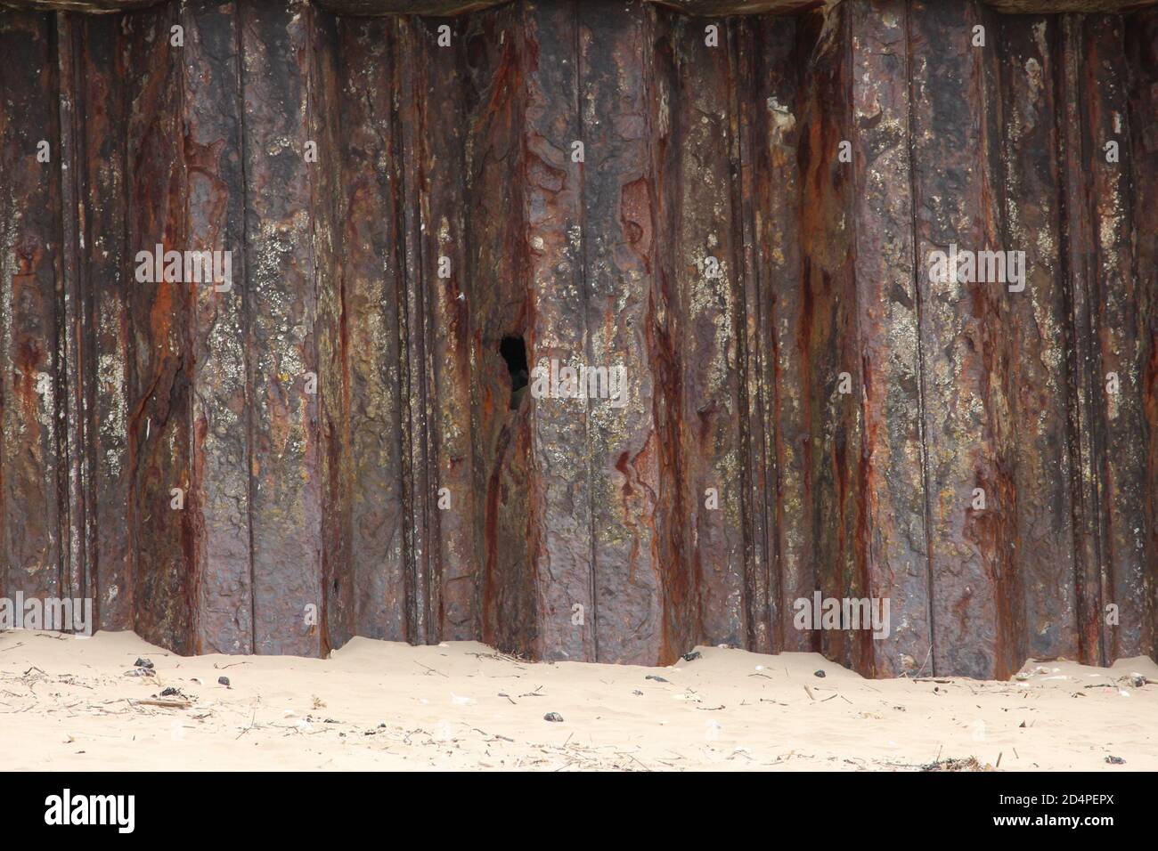 A close up photograph of harbour protection on the coast in Wales. Old ...