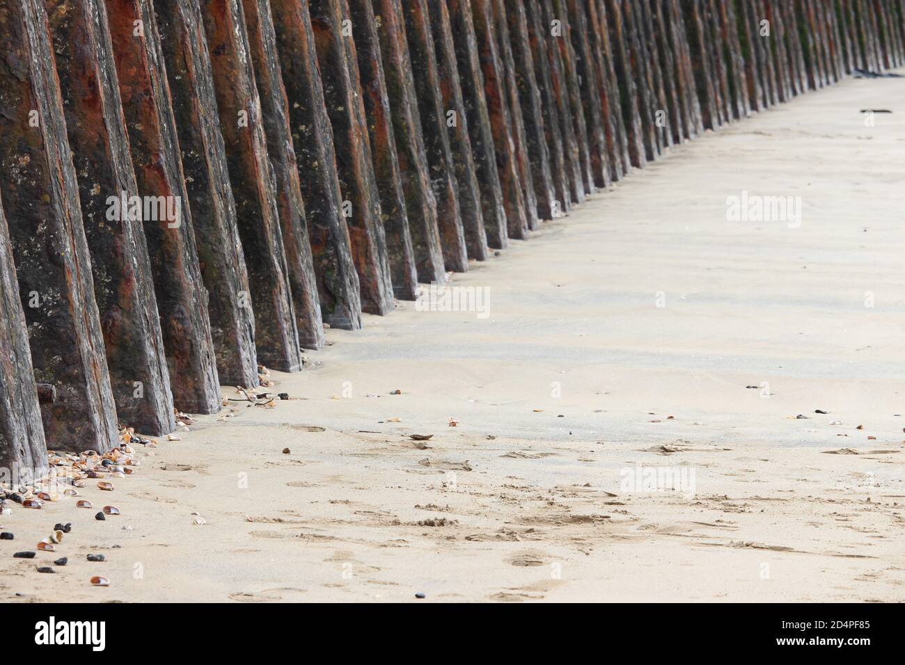 What Is Rusting Barrier A close up photograph of harbour protection on the coast in Wales. Old ...