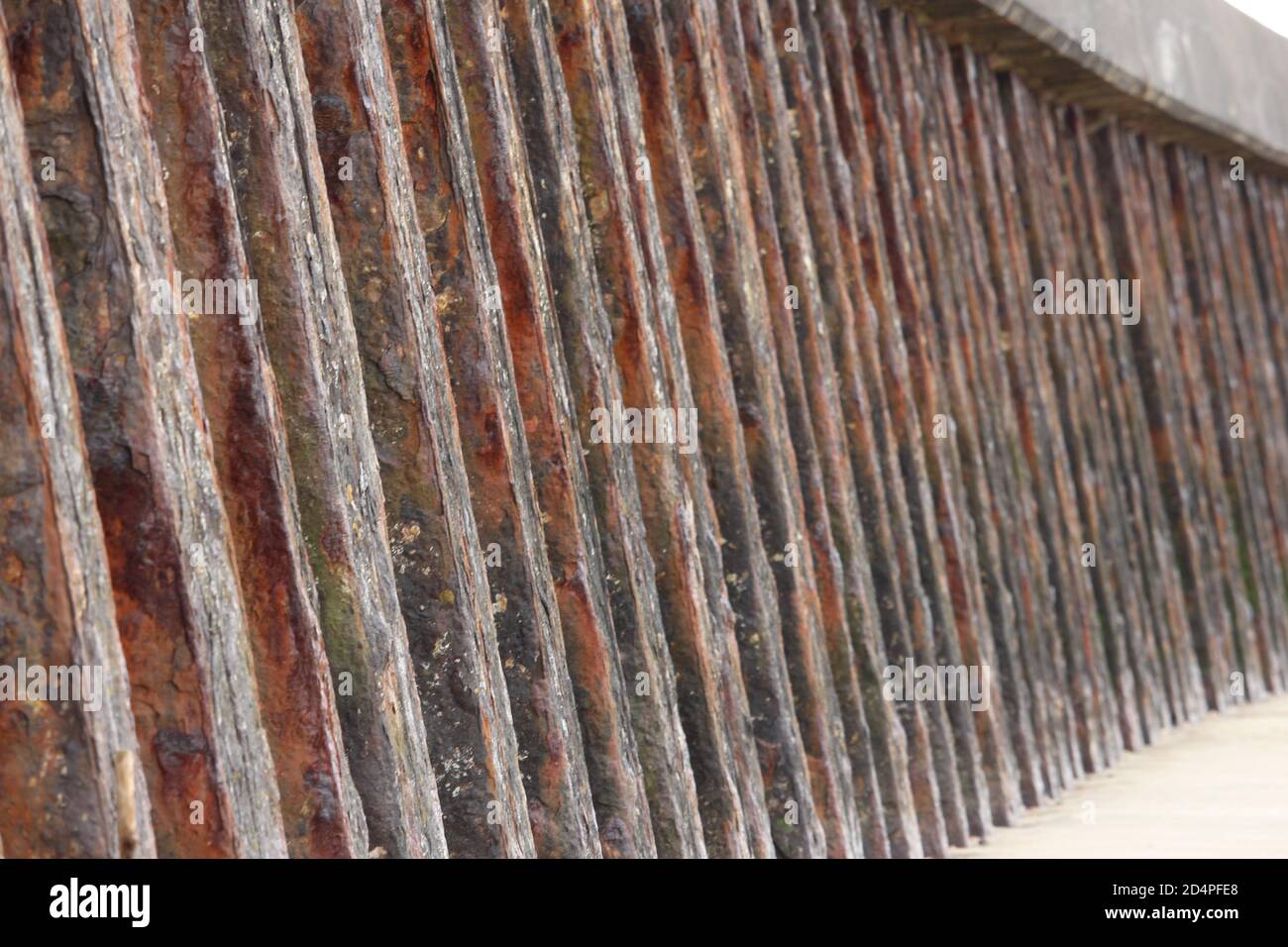 What Is Rusting Barrier A close up photograph of harbour protection on the coast in Wales. Old ...