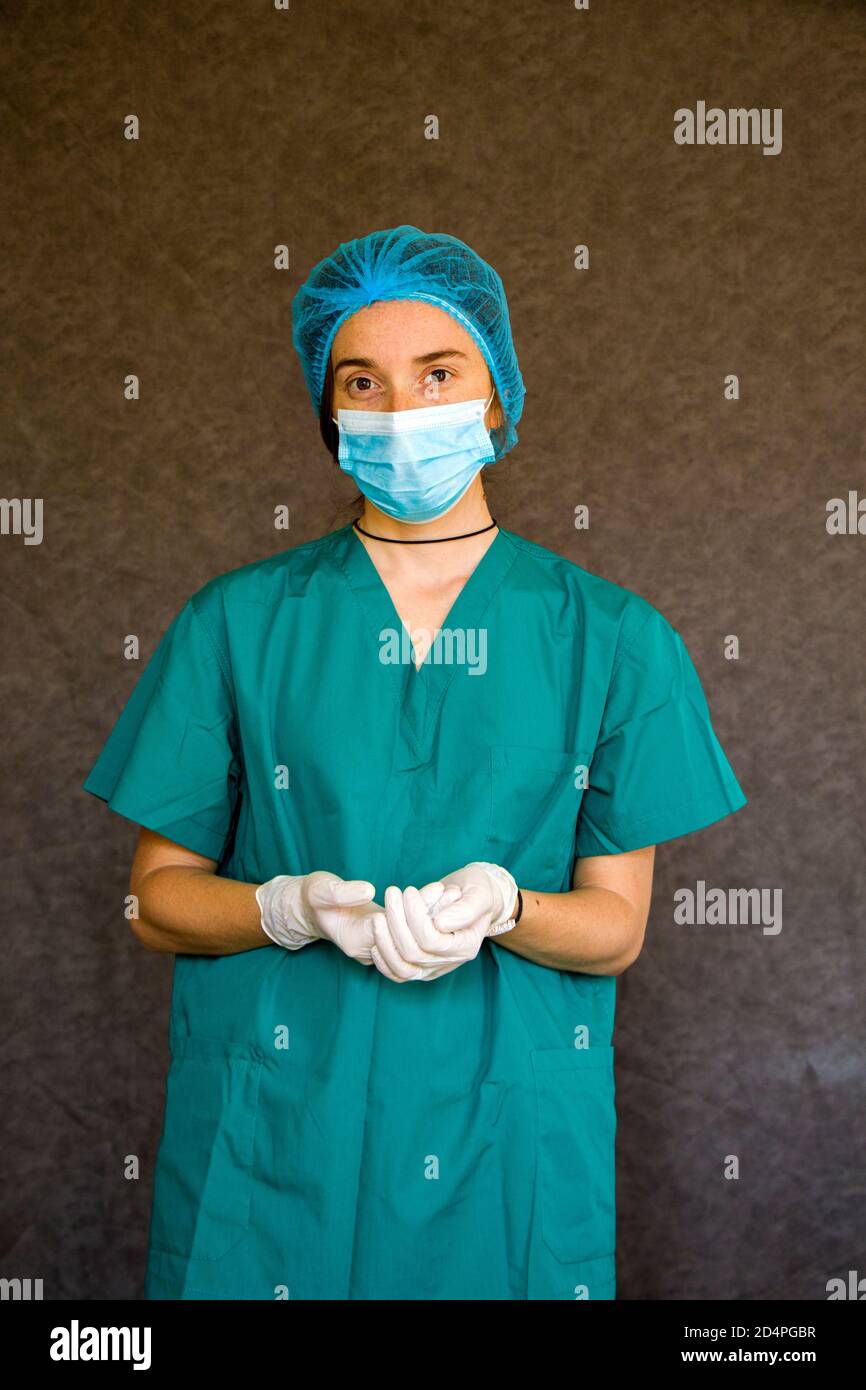Woman doctors portrait, doctors with mask, glove and uniform. Uniform for surgery and viruses. Stock Photo