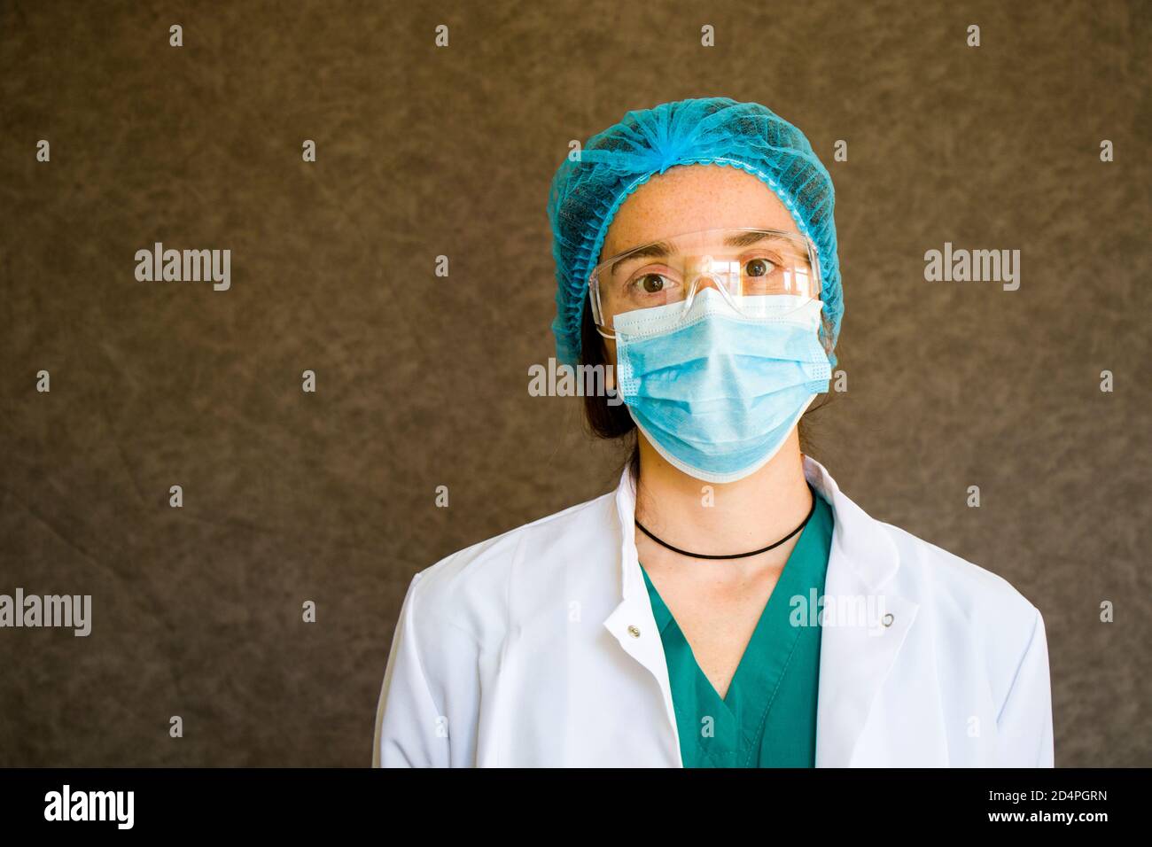 Woman doctors portrait, doctors with mask, glasses, glove and uniform. Uniform for surgery and pandemic. Stock Photo