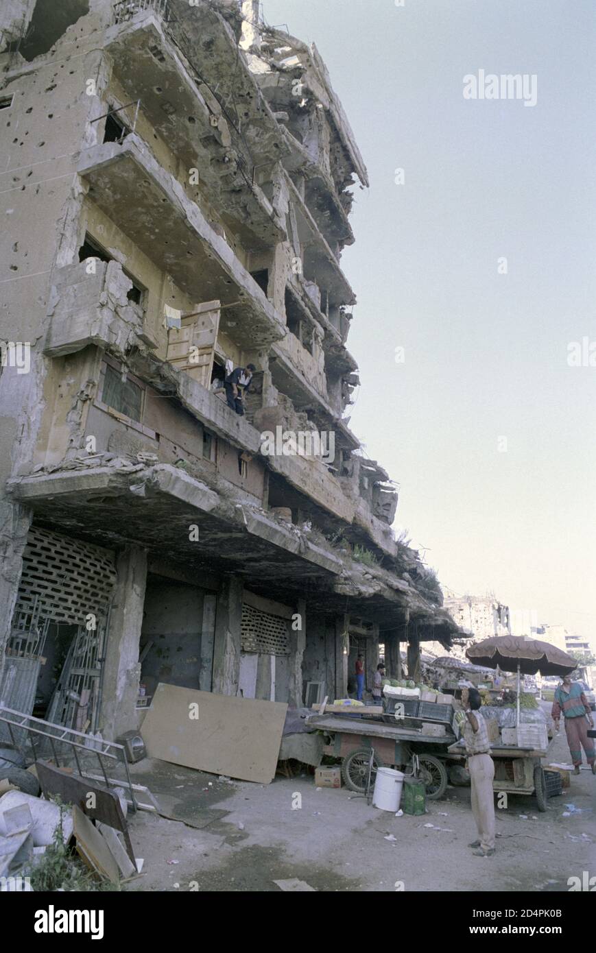 18th September 1993 After 15 years of civil war, life goes on in a battle-scarred building on Michel Zakhour street, Beirut. Stock Photo