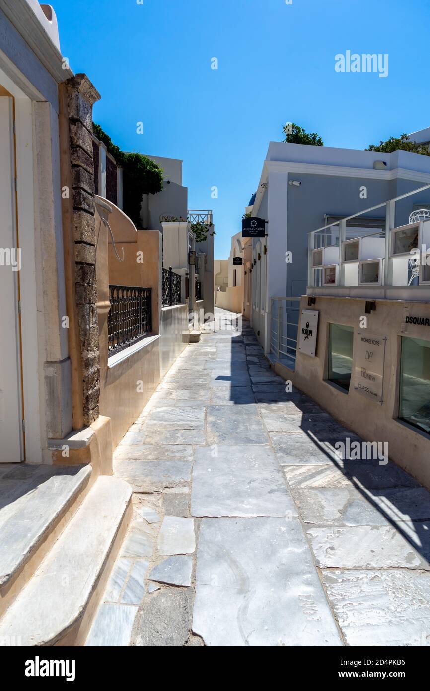 Empty street of Oia town in Santorini island, Greece on a sunny day Stock Photo