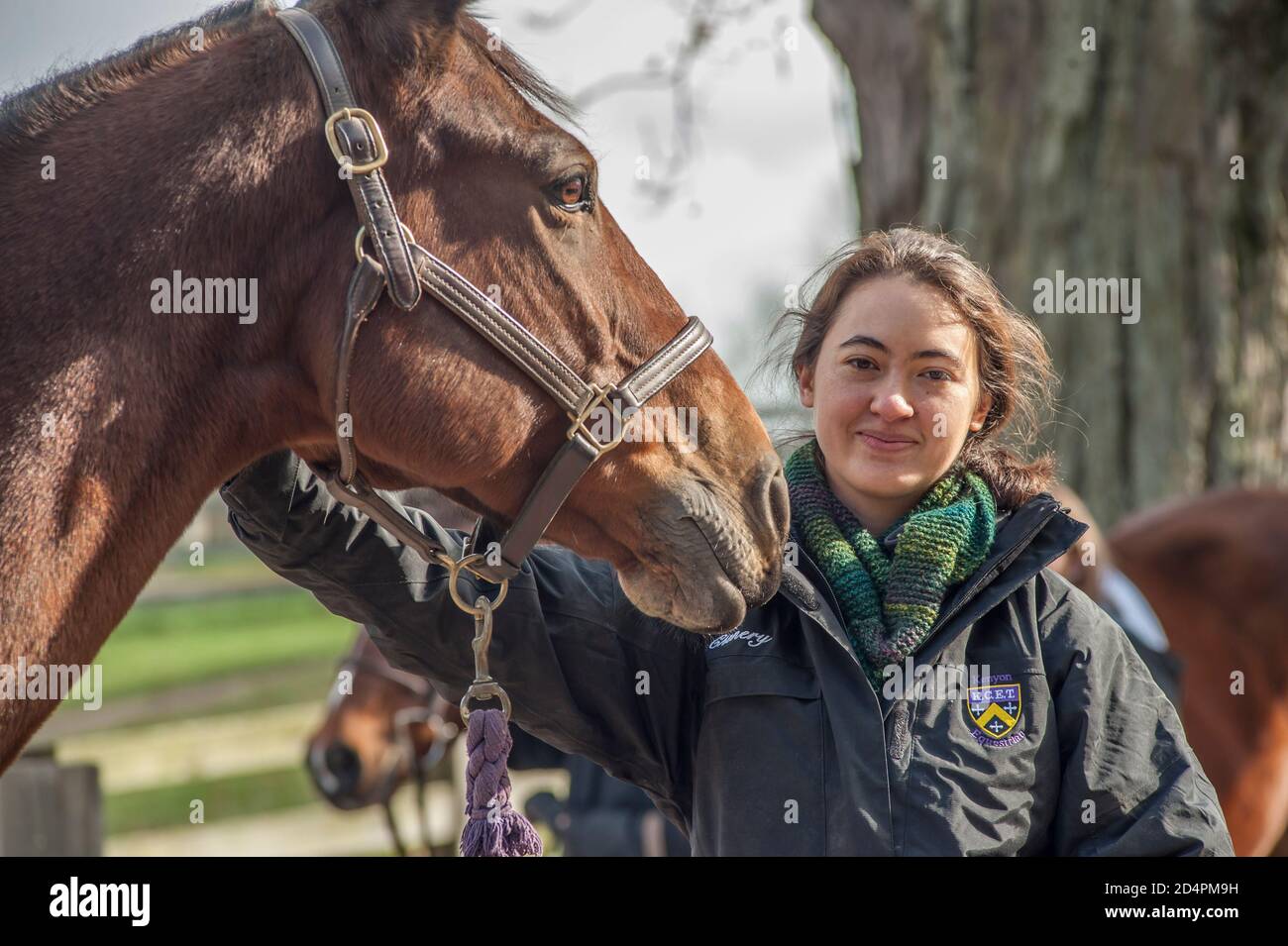 Teen girl equestrian poses with horse Stock Photo