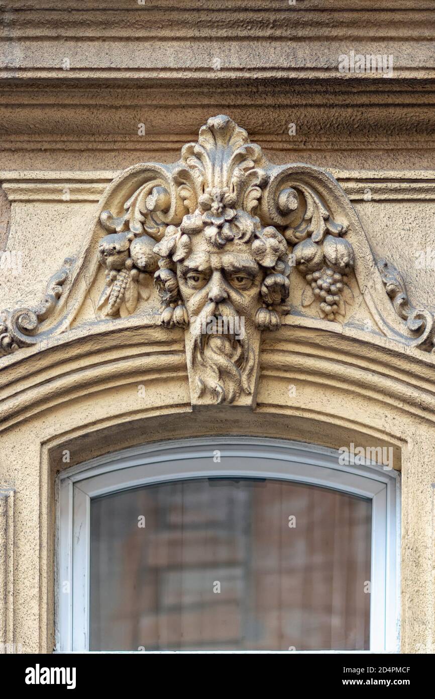 Elements of architectural decorations of buildings, gypsum stucco, plaster ornament. On the street of Budapest, public places. Stock Photo