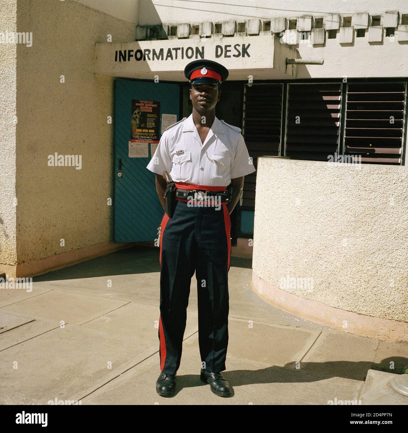 A Jamaican policeman stood outside a station Stock Photo Alamy