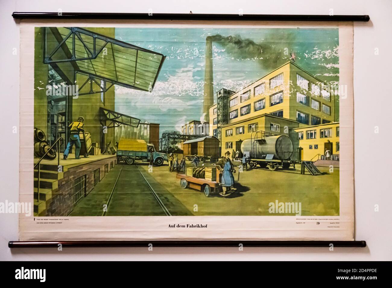 In the factory yard. Explanatory poster from a school in the GDR, Röbel-Müritz, Germany Stock Photo