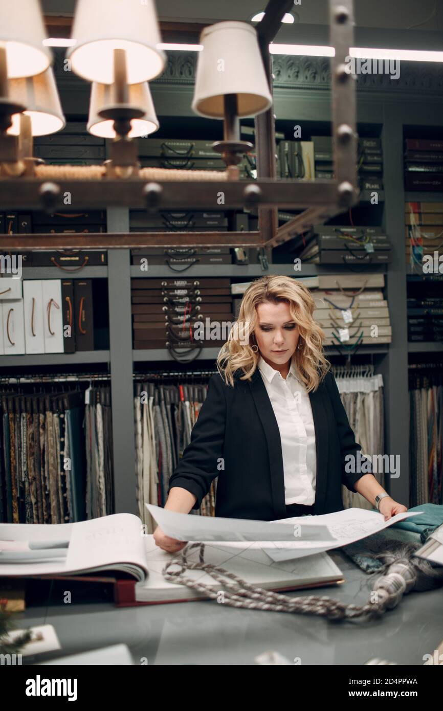 Interior designer woman at work in office project. Design and interior ...