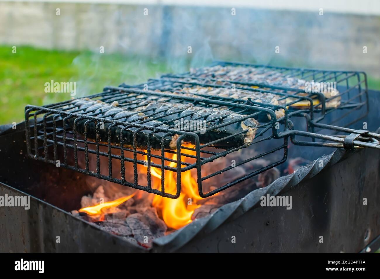fish, mackerel roasting on the barbecue grill Stock Photo