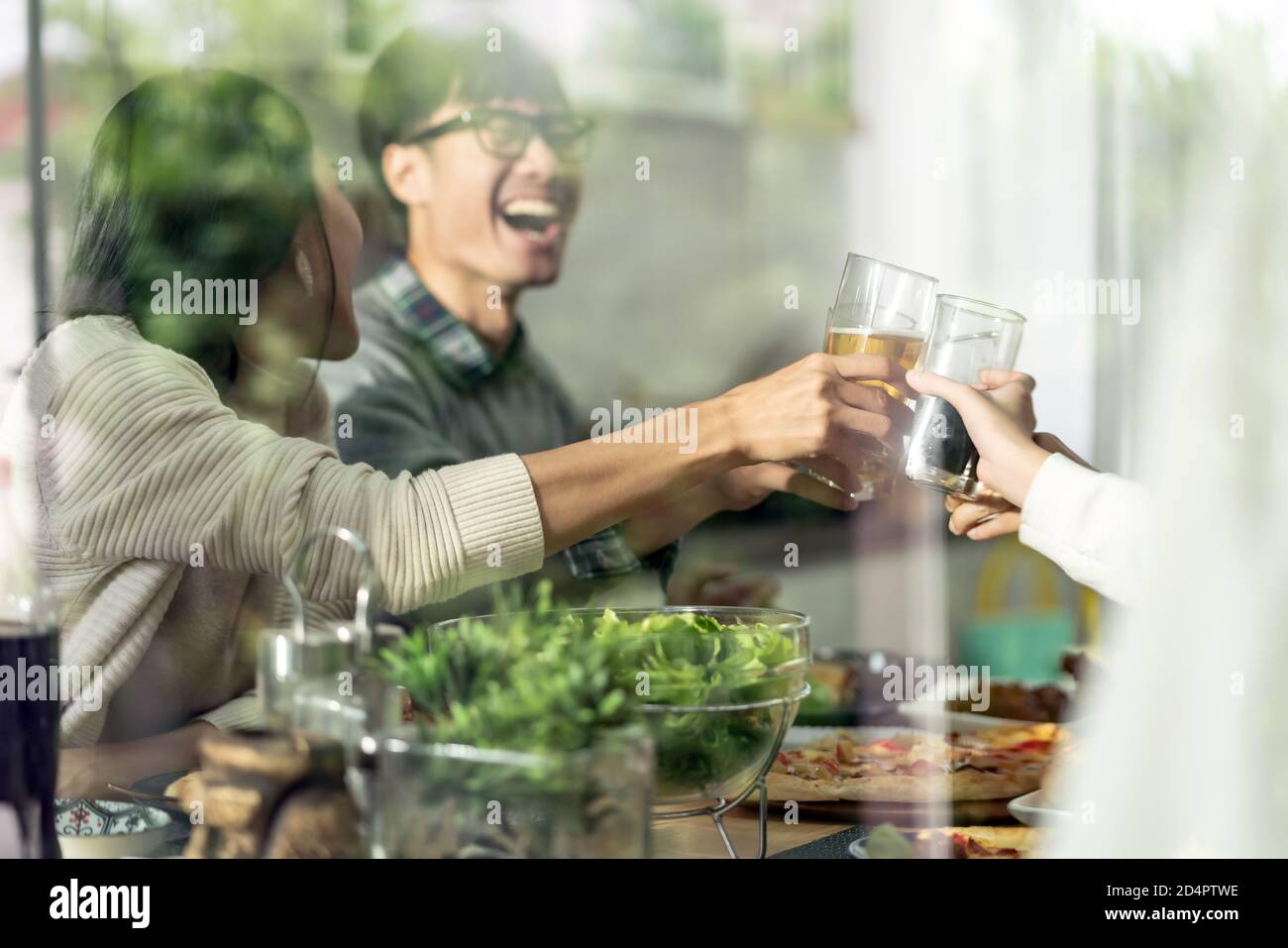 Happy asian multigenerational family of dad mom daughter girl and grandfather cheers together during lunch meal together with joyful. Happy family eng Stock Photo
