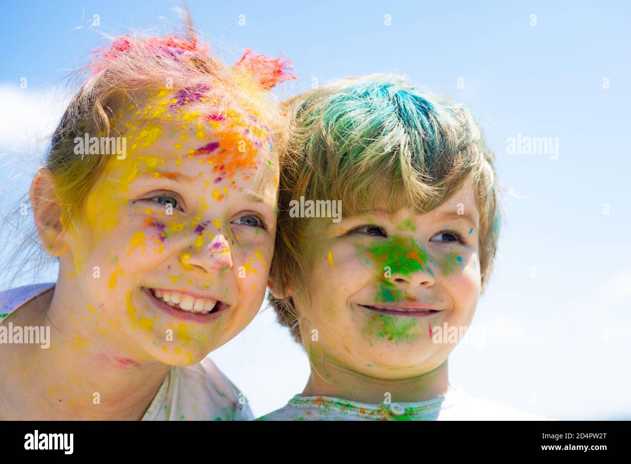 Children draws paints. Funny kids faces in colorful color holi. Close up  portrait of little friends with faces coloured with gulal Stock Photo -  Alamy