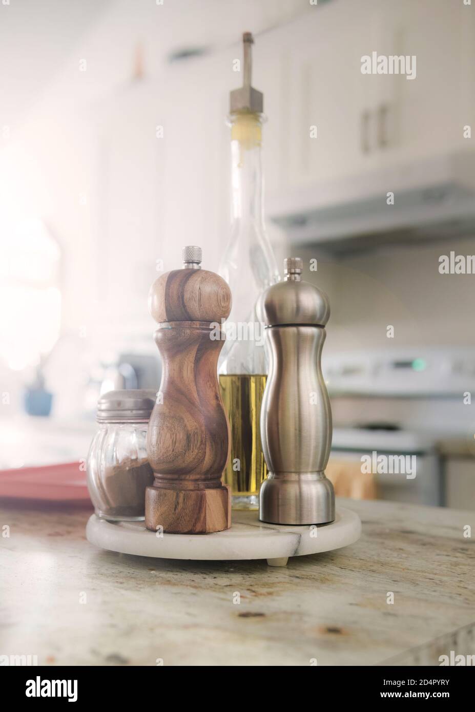 https://c8.alamy.com/comp/2D4PYRY/on-the-kitchen-counter-there-is-salt-pepper-cinnamon-and-olive-oil-a-stainless-steel-salt-mill-and-a-wooden-pepper-mill-2D4PYRY.jpg