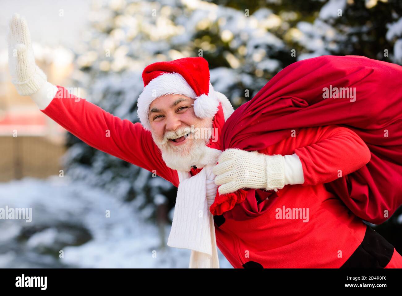 Happy Santa grandfather deliver gifts. Smiling Santa Claus in Christmas ...