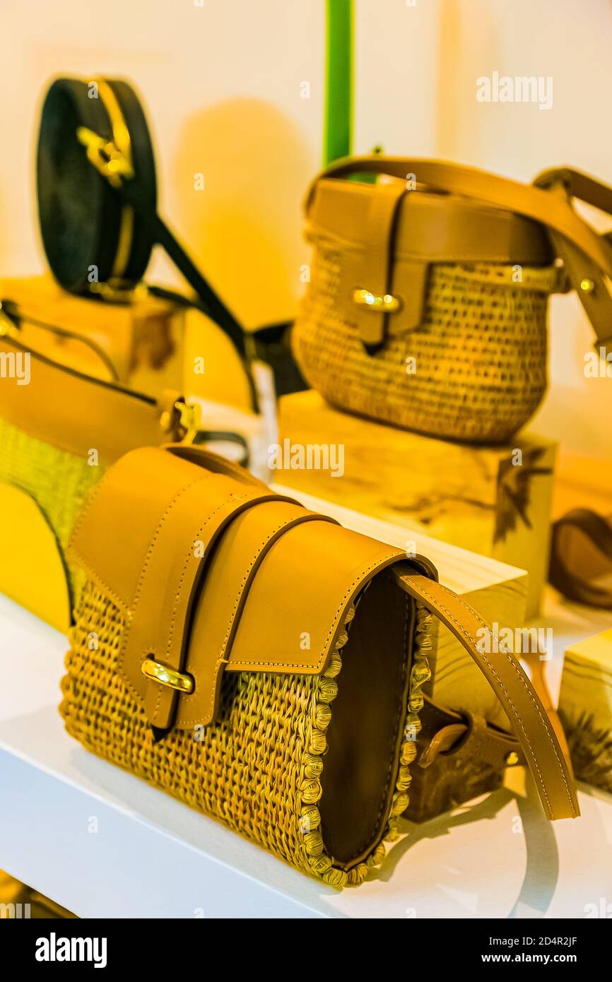 Yellow female bags on sale in a fashion boutique Stock Photo Alamy