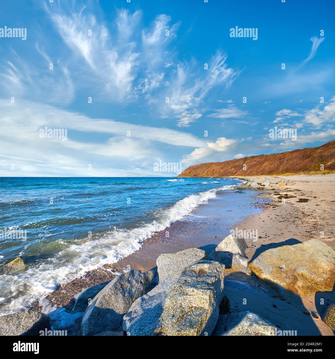 Stones protecting sand on beach. Beach near Kloster on island Hiddensee, Germany in Autumn Stock Photo
