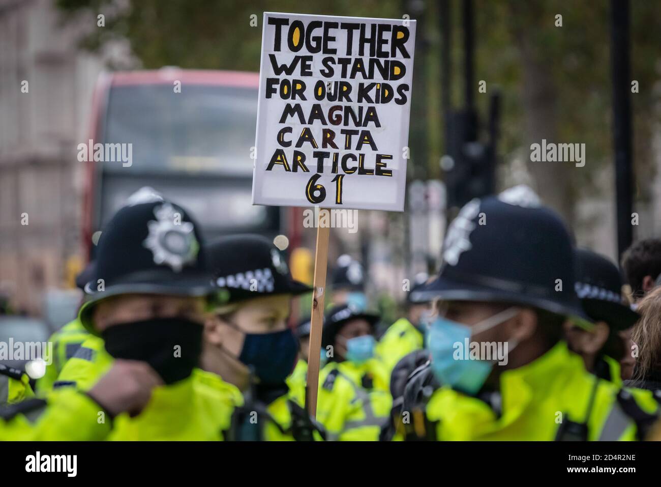 London, UK. 10th October, 2020. Anti-covid19 protesters rally opposite Downing Street under a heavy police presence as part of on-going demonstrations against the current government imposed Coronavirus restrictions. The conspiracy theorists continue to claim the pandemic is an orchestrated hoax and demand no further lockdown regulations, no social distancing, no masks, no track and trace, no health passports, no mandatory vaccinations and no 'new normal'. Credit: Guy Corbishley/Alamy Live News Stock Photo