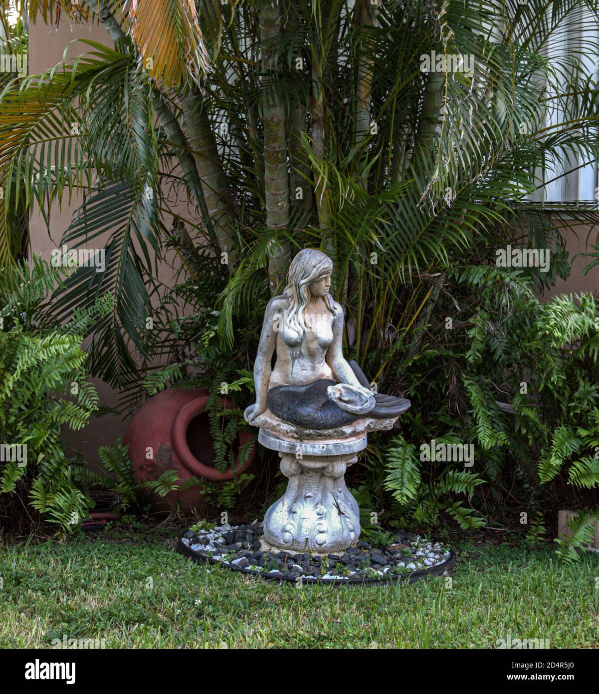beautiful mermaid in our garden somewhere in miami Stock Photo