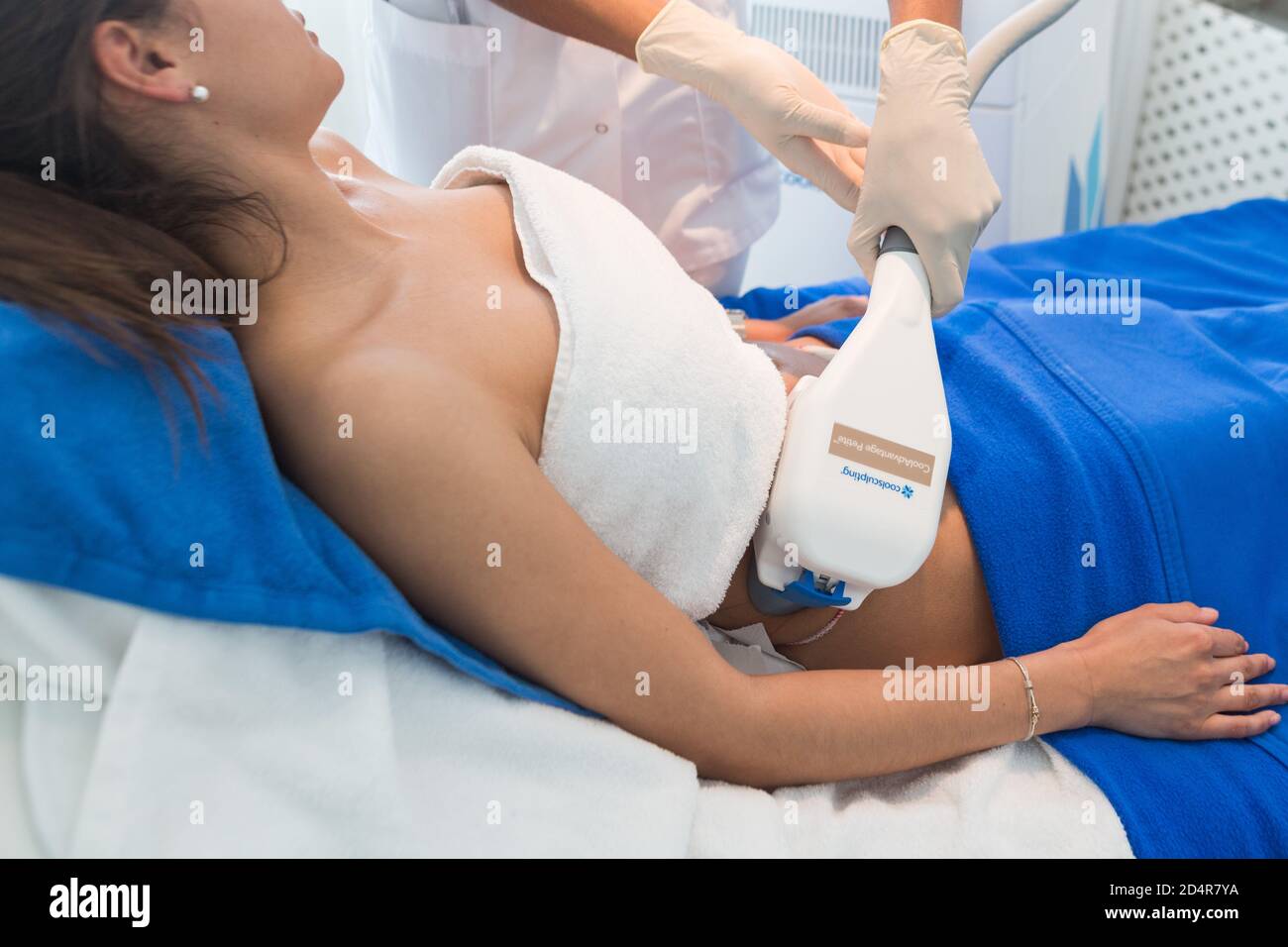 CoolSculpting ®, Cryolipolysis session, noninvasive method of permanent reduction of localized fat, France. Stock Photo
