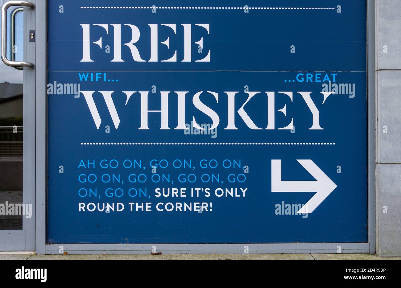 White on blue sign with Free Whiskey spelled out Stock Photo