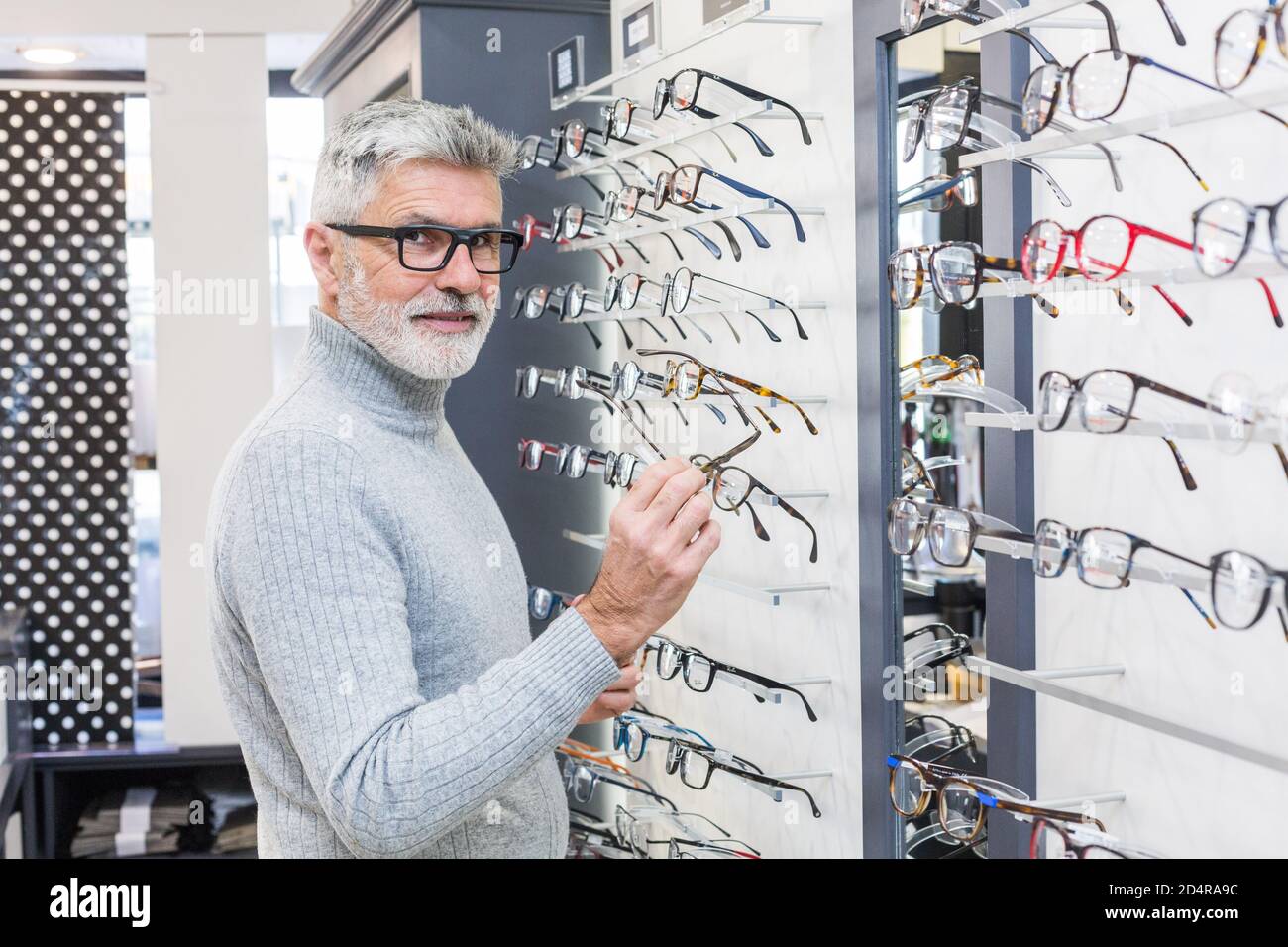 Man trying prescription glasses. Stock Photo